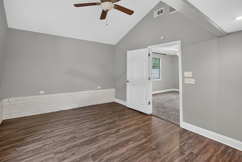 Bedroom with vaulted ceiling and wood floor at 12344 Cormorant Ct, Jacksonville, FL