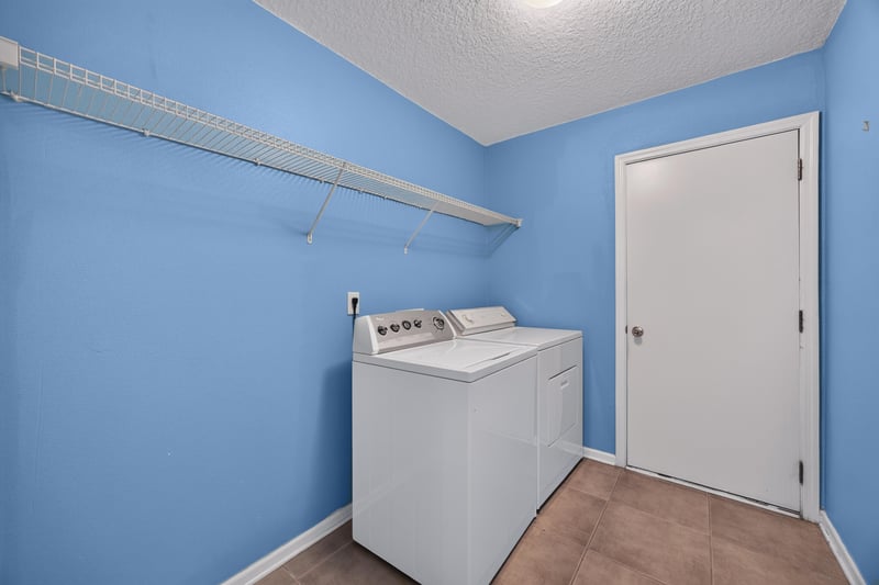 Laundry closet with washer and dryer at 2282 Justin Lake Dr, Jacksonville, FL
