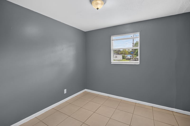 Empty bedroom with tile floor and window at 6745 Jack Horner Ln, Jacksonville, FL 32210