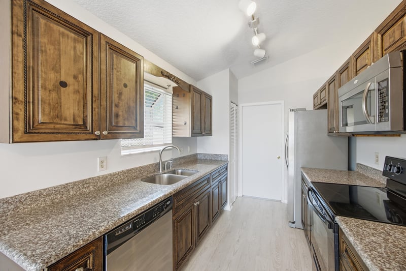 Kitchen sink area with cabinets at 678 5th Ave N, Jacksonville Beach, FL 32250
