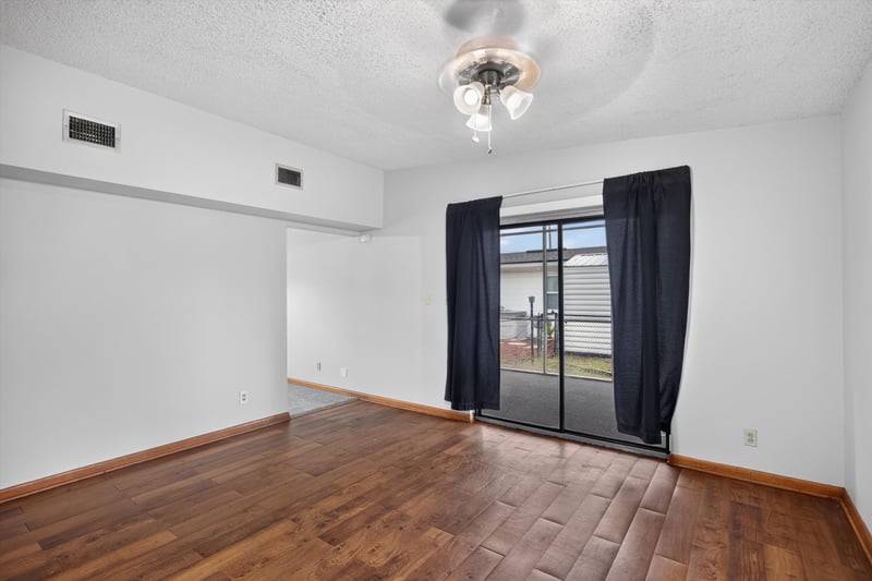 Dining room with wood floor and patio door at 11462 Elane Dr, Jacksonville, FL