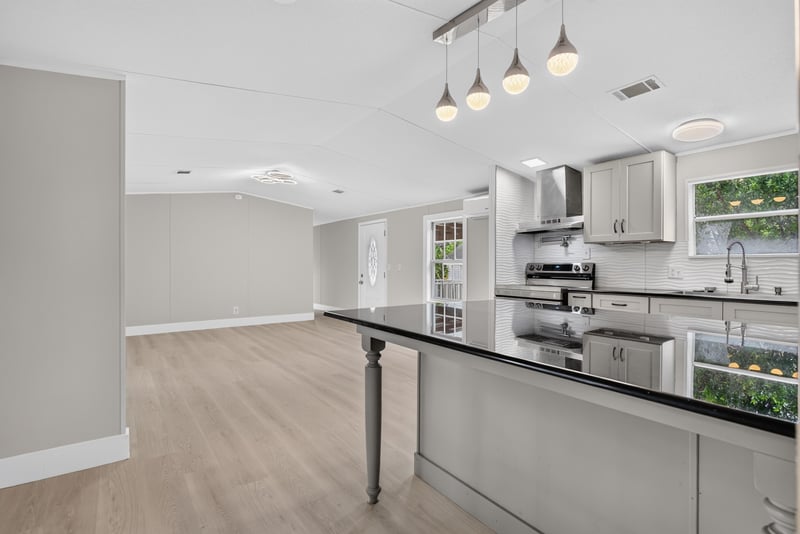 Open kitchen and living space with island at 4565 Appleton Ave, Jacksonville, FL