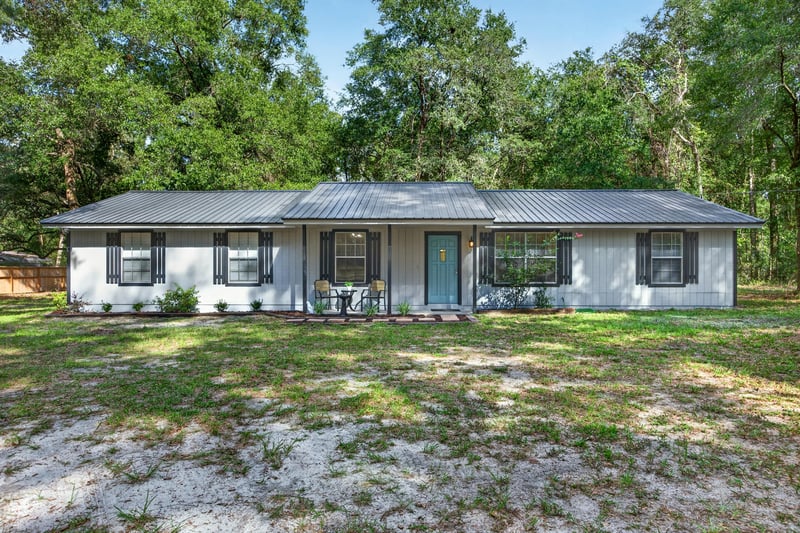 Front exterior with metal roof and covered porch at 2829 Blackberry Ave