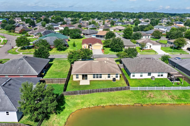 Aerial view of the backyard and pond at 7545 Lirope St, Jacksonville, FL 32244