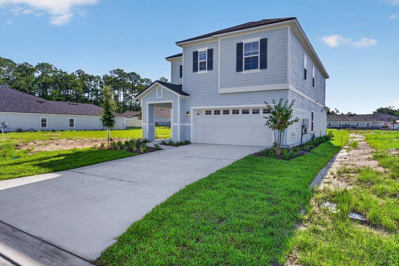 Front exterior with unfinished landscaping and driveway at 269 Bluegrass Wy, St. Augustine, FL 32092