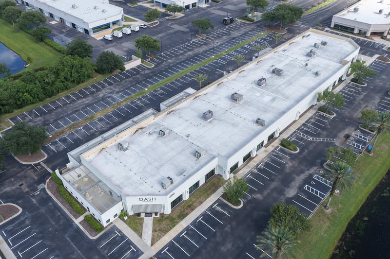 Aerial view of a building roof and parking lot at 10550 Deerwood Park Blvd, Jacksonville, FL 32256