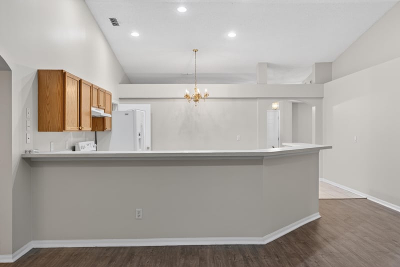 Kitchen pass-through bar with pendant light at 1648 Glen Laurel Dr, Middleburg, FL 32068