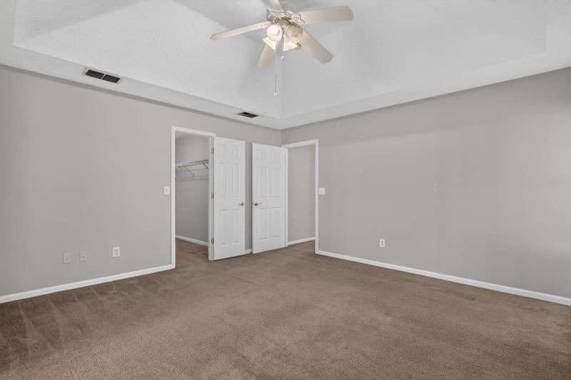 Empty carpeted room with window at 11669 Collins Creek Dr, Jacksonville, FL 32258