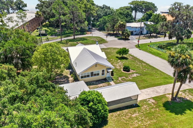 Drone view of house and neighborhood at 101 N Lake St, Crescent City, FL