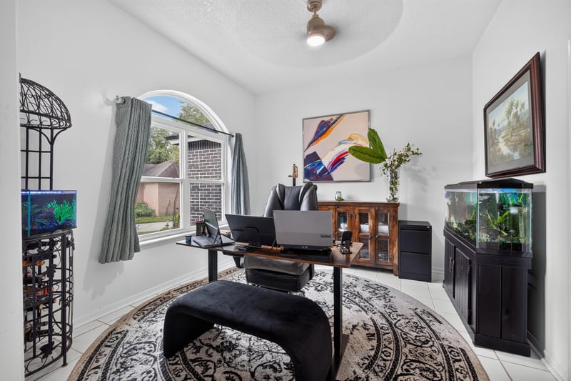 Living room with vaulted ceiling and office nook at 1346 Gately Ct, Jacksonville, FL 32225