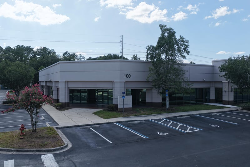 Office building front with landscaped curb at 10550 Deerwood Park Blvd, Jacksonville, FL 32256