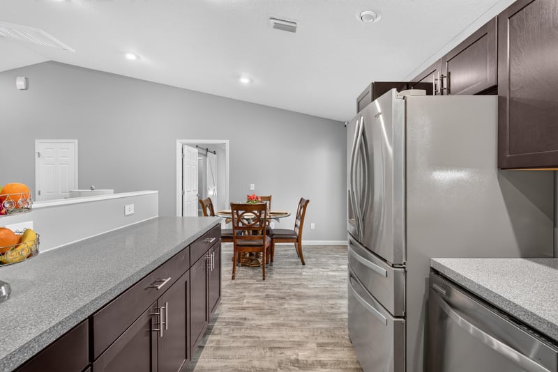 Kitchen wide angle with dining view, photographed by Megapixeler on Birch Run E, Orange Park