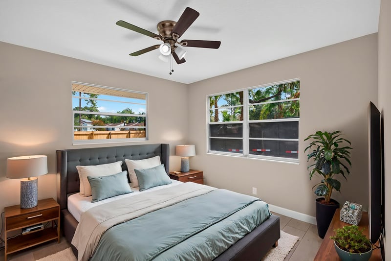 Bedroom with virtually staged bed and ceiling fan at 4117 Wilcrest Ct, Jacksonville, FL 32277