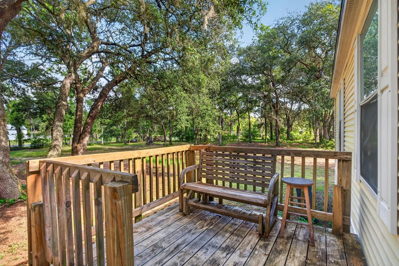 Wood deck and railing off the front entry at 3215 Robin Ln, Middleburg, FL