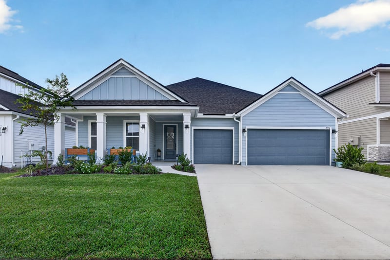 Front exterior with stone accents and covered porch at 2354 Jennings Farm Dr, Middleburg, FL 32068