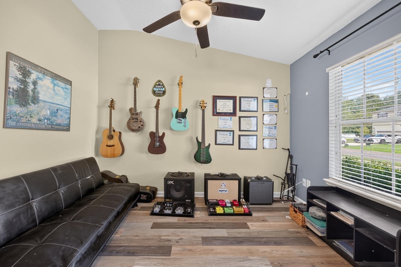 Bonus room with mounted guitars and shelving at 2065 Creekmont Dr
