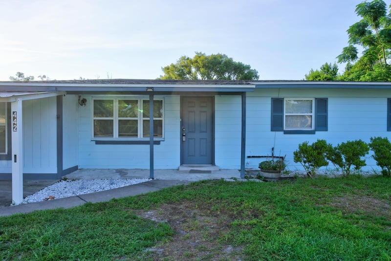 Front entry door and covered stoop at 442 Ameca Ave, Orange Park, FL 32073