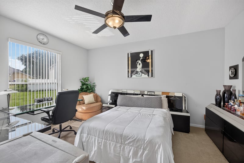 Bedroom with desk and ceiling fan at 2875 Pebblewood Ln, Orange Park, FL 32065