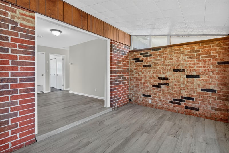 Open area with brick accent wall at 5503 Boeing Dr, Jacksonville, FL 32207