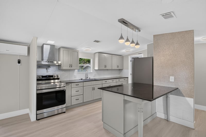 Kitchen with gray cabinets and dark countertops at 4565 Appleton Ave, Jacksonville, FL