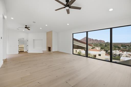 Primary bedroom with Camelback Mountain through the windows, empty