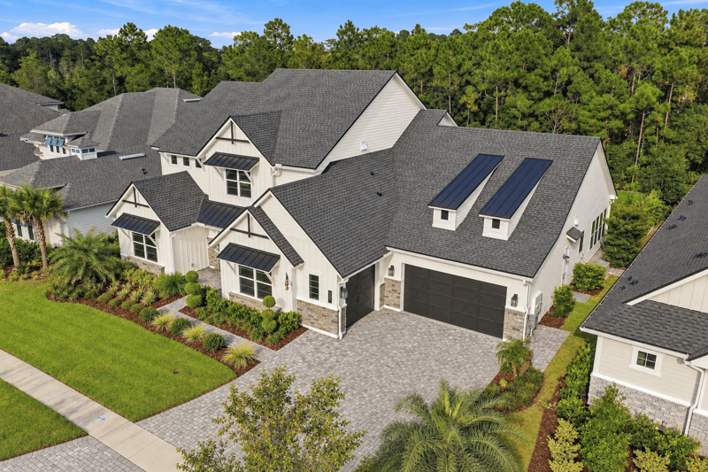 Aerial view of the home with rooftop solar panels at 907 Seagrove Dr, Ponte Vedra Beach, FL 32081