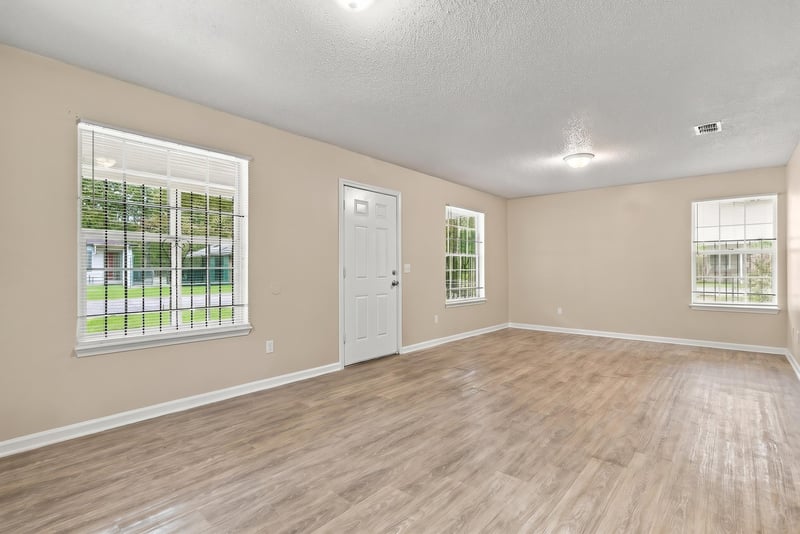 Open living and dining space with wood flooring at 219 Shortreed St, Jacksonville, FL 32254