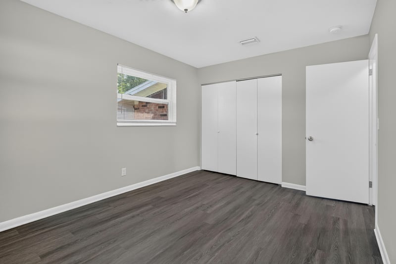 Bedroom with window and closets at 5503 Boeing Dr, Jacksonville, FL 32207