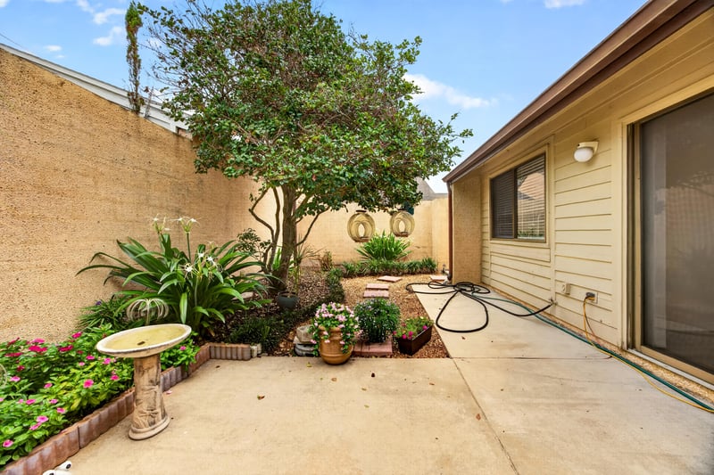 Courtyard patio with bird bath and landscaping at 3407 Fairbanks Grant Rd N, Jacksonville, FL 32223