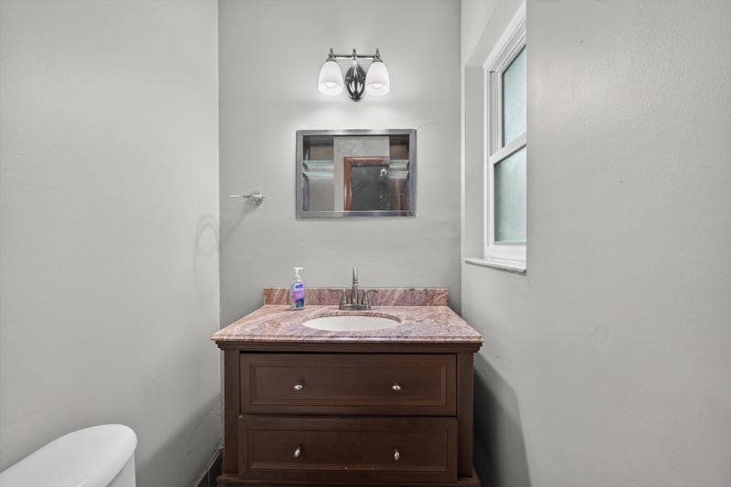 Bathroom with wood vanity and mirror at 11462 Elane Dr, Jacksonville, FL