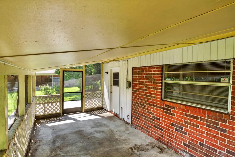 Brick breezeway with door to backyard at 5503 Boeing Dr, Jacksonville, FL 32207