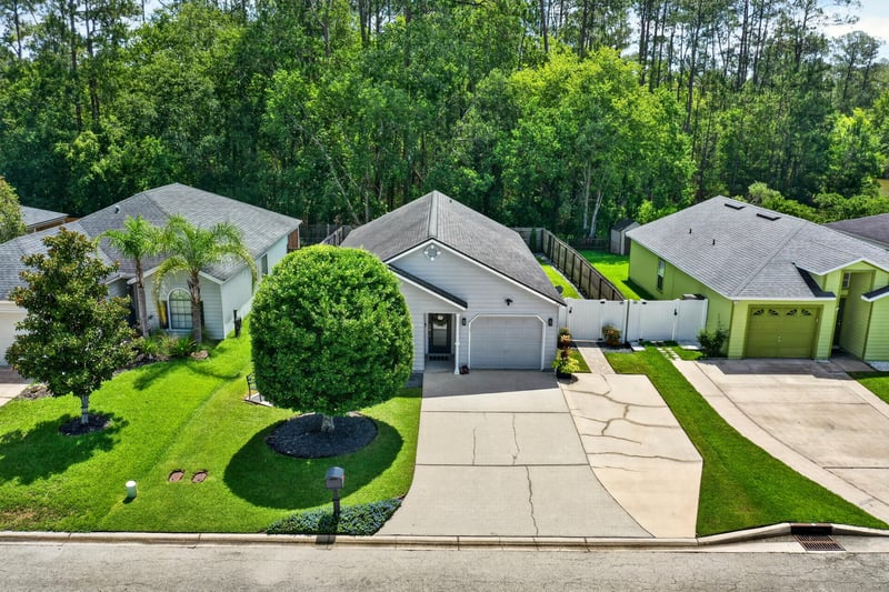 Drone view of front yard and driveway at 3067 Wavering Ln, Middleburg, FL 32068