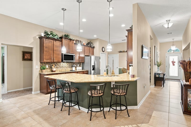 Kitchen with island and bar seating at 10923 Black Diamond Ct, Jacksonville, FL
