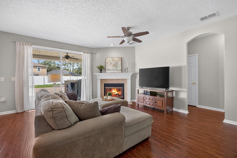 Living room with fireplace and television at 3660 Middlebrook Dr, Orange Park, FL 32065