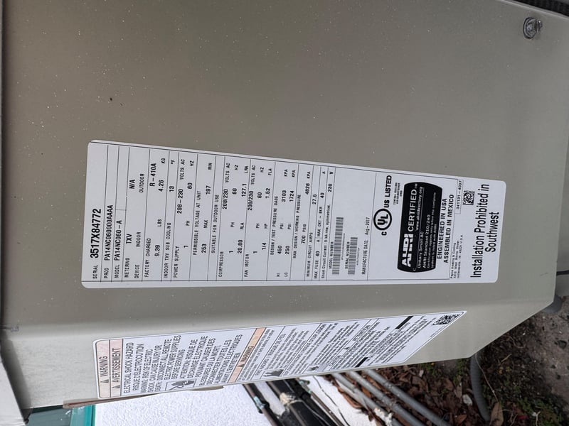 Condenser unit nameplate and specifications label at 11700 New Kings Rd, Jacksonville, FL 32219