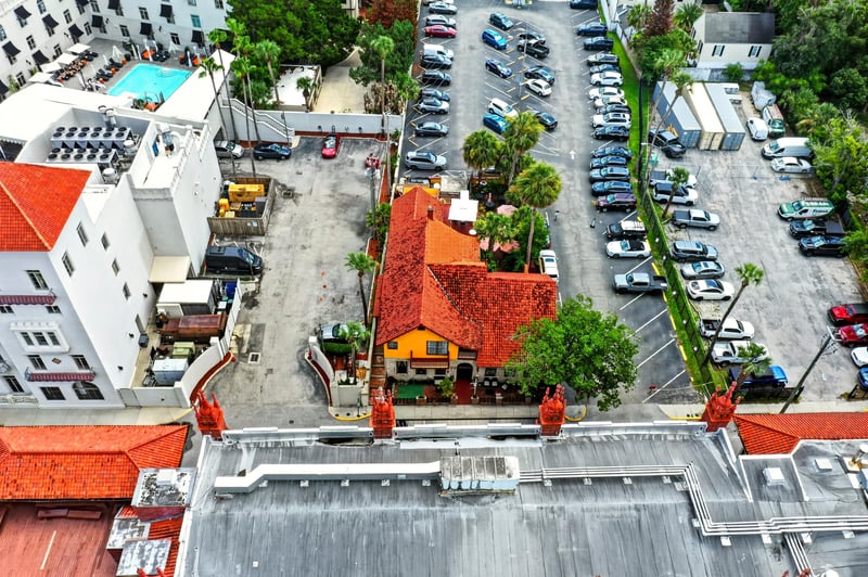 Aerial view of red tile rooftops and a parking area at 115 Cordova St, St. Augustine, FL