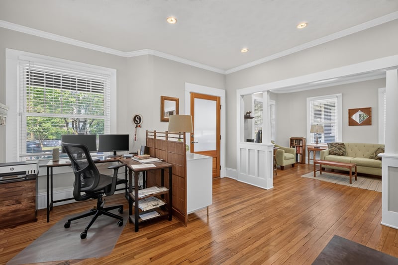 Home office nook with desk in front of a fireplace at 1555 Belmonte Ave, Jacksonville, FL 32207