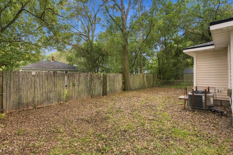 Backyard with privacy fence and trees at 219 Shortreed St, Jacksonville, FL 32254