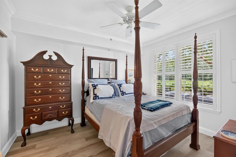 Bedroom with four-poster bed and chest of drawers at 10435 Mid Town Pkwy unit 135, Jacksonville, FL 32246