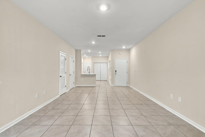 Hallway with tile floor and multiple doors at 9555 Star Dr, Jacksonville, FL 32256