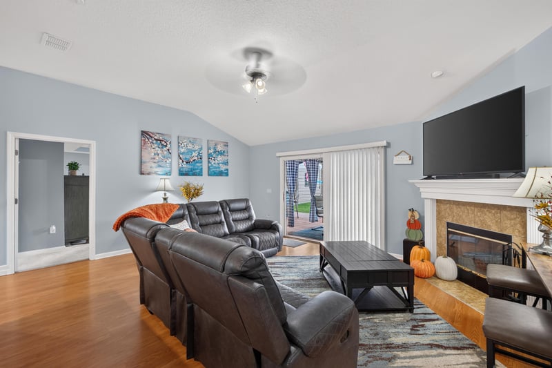 Family room with fireplace and sliding glass door at 3112 Silverado Cir, Green Cove Springs, FL 32043