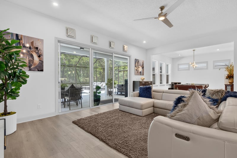 Living room with sliding glass doors to the lanai at 785 Back Creek Dr, St. Augustine, FL 32092