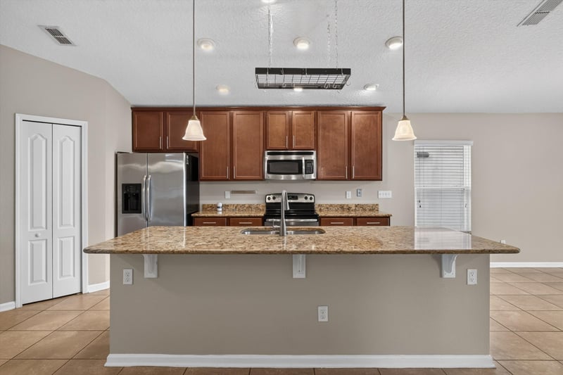 Kitchen with granite counters and pendant lighting at 469 Glendale Ln, Orange Park, FL