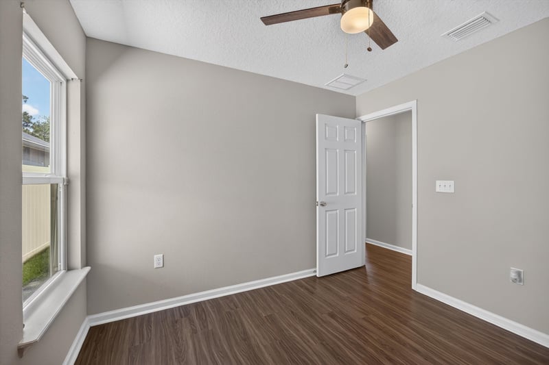 Hallway with bedroom door at 7118 Preston Pnes Trl, Jacksonville, FL