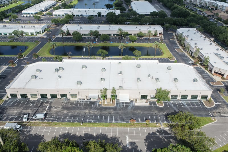 Aerial view of a roofline with ponds and parking lots at 10550 Deerwood Park Blvd, Jacksonville, FL 32256