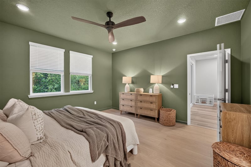 Primary bedroom with bed and nightstands at 93 Lochloosa Ct, St. Johns, FL 32259