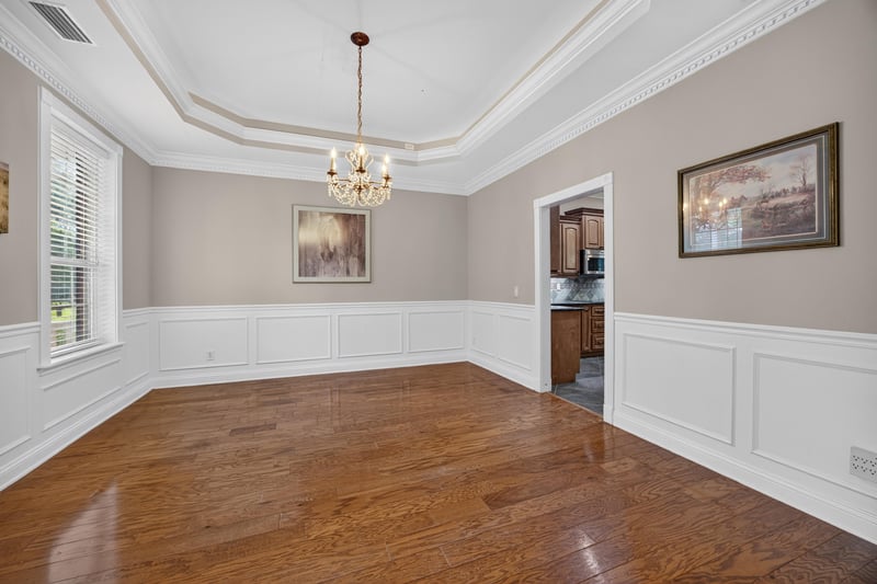 Dining room with wainscoting and chandelier at 1735 Hagans Ridge Ct