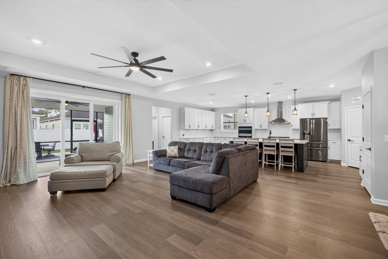 Living room open to kitchen with tray ceiling at 2354 Jennings Farm Dr, Middleburg, FL 32068