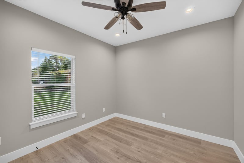Bedroom with window and ceiling fan at 175 Alava Ct
