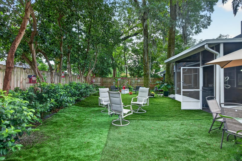 Backyard lawn with storage shed and seating at 1346 Gately Ct, Jacksonville, FL 32225